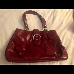 Coach patent leather deep red handbag.